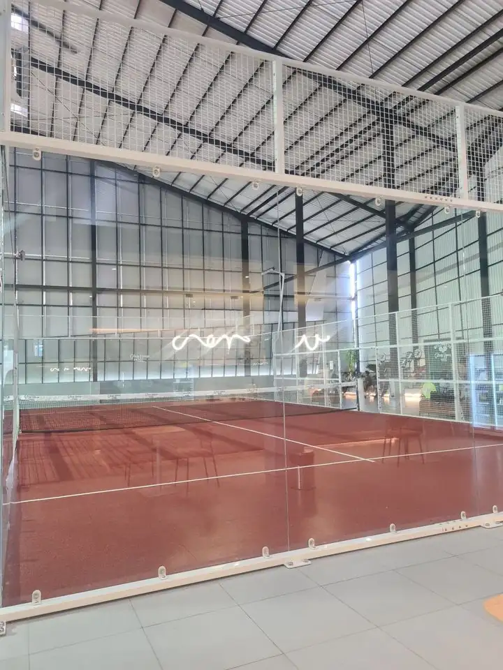 Panoramic glass wall of a court at Glass House Padel